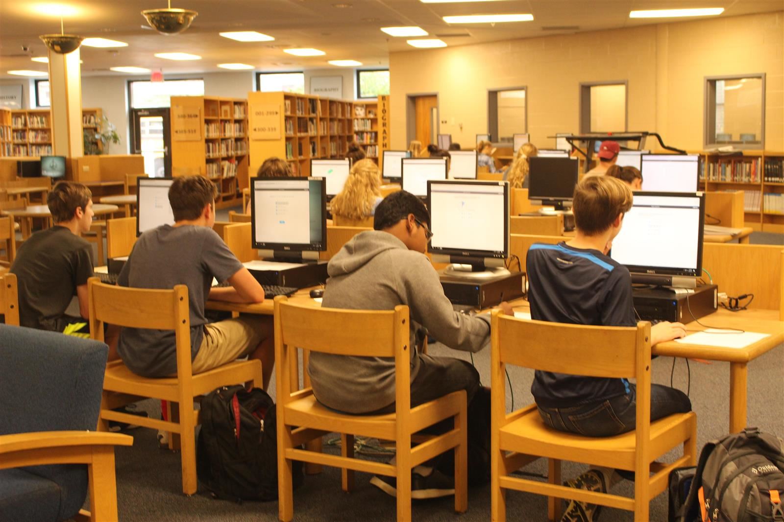 Students working at library computers